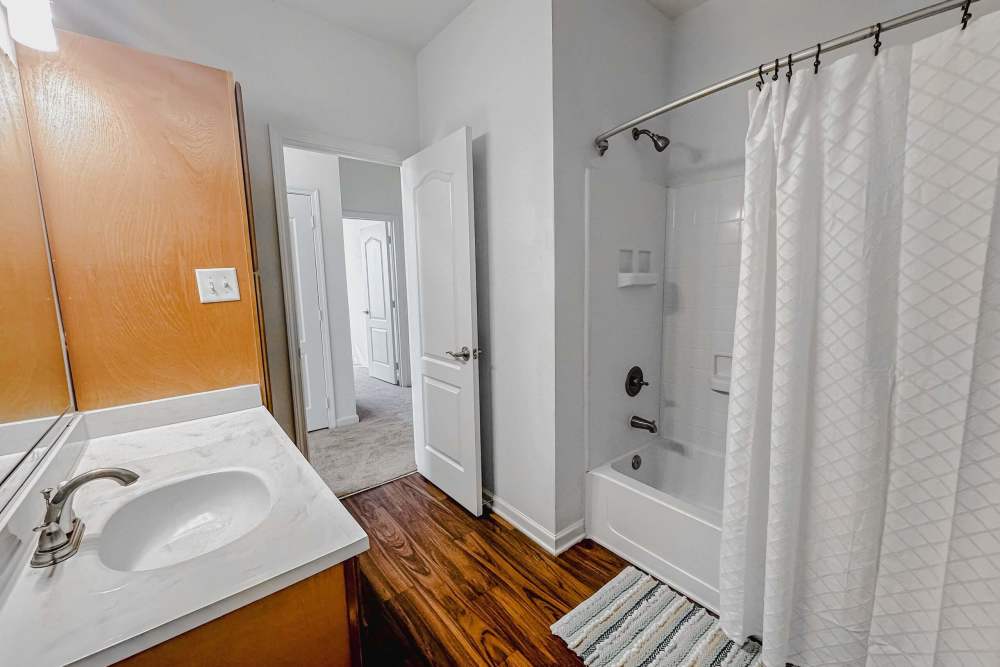 Bright bathroom with white vanity unit at Windsor Upon Stonecrest in Burlington,North Carolina