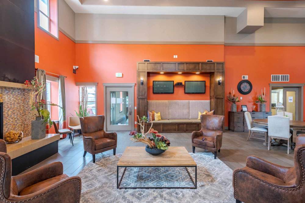 Living room at the Park at the Edge apartments in Fort Worth, TX, featuring modern furniture and large windows for natural light at Meadowbrook Station Apartments in Salt Lake City, Utah