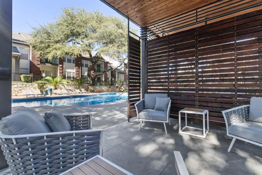 Outdoor patio area by the pool deck at Charleston in San Antonio,Texas