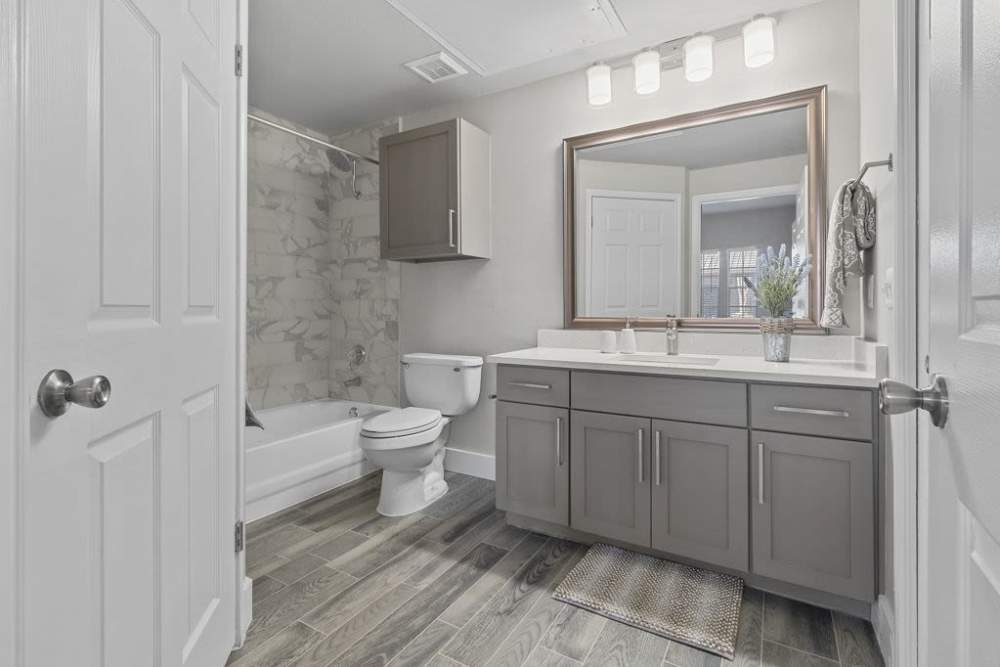 Bathroom with wood-style flooring and vanity unit at Charleston in San Antonio,Texas