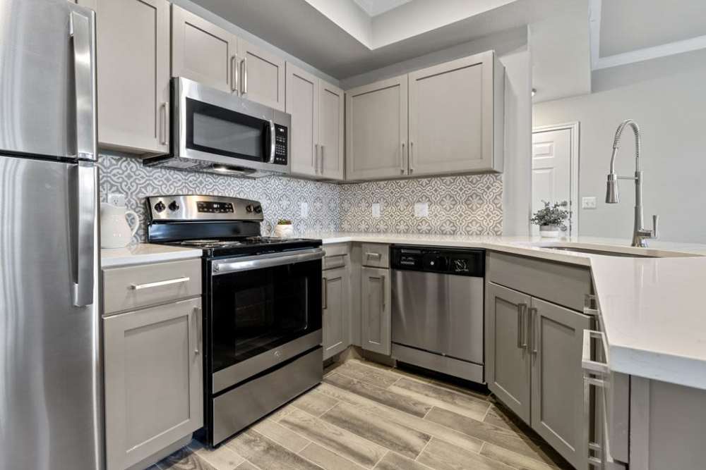 Kitchen with latest appliances including fridge and dishwasher at Charleston in San Antonio,Texas