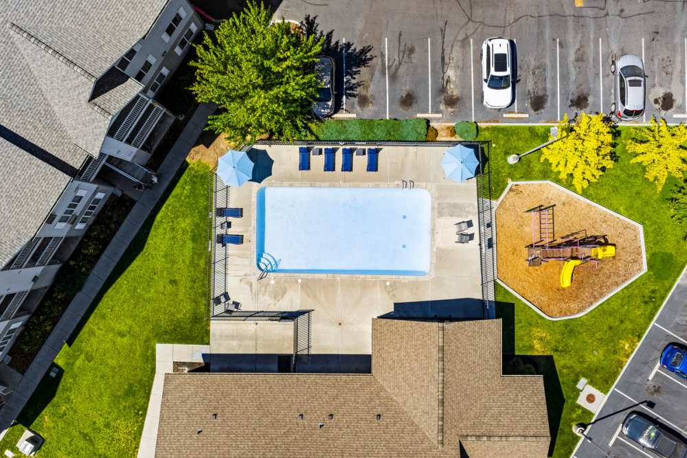 Heron Creek Amenities Pool & Playground (Overhead) Photo Gallery | Heron Creek Apartments in Moses Lake, Washington