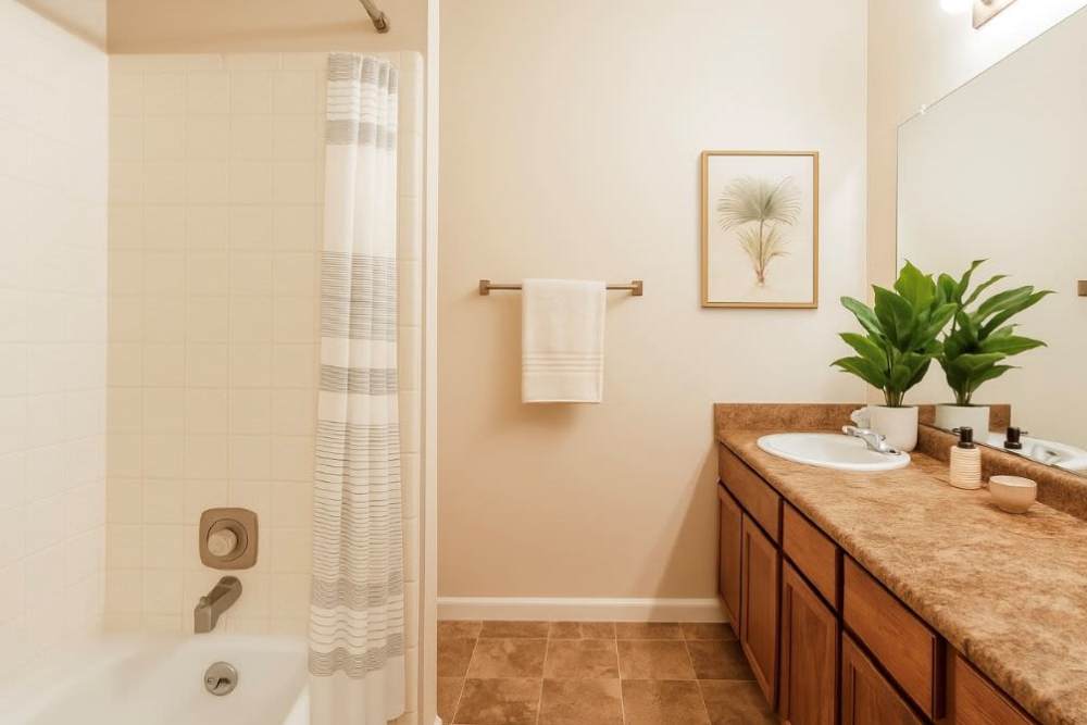 Bathroom with a mirror at Tabby Villa Apartments in Savannah, Georgia