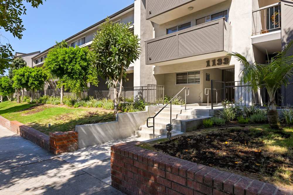 Grassy walking path with trees surrounding at The Indie Glendale Collection, Glendale, California