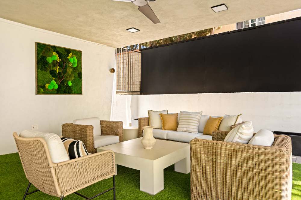 lounge area with seating under a covered patio at The Indie Glendale Collection in Glendale, California