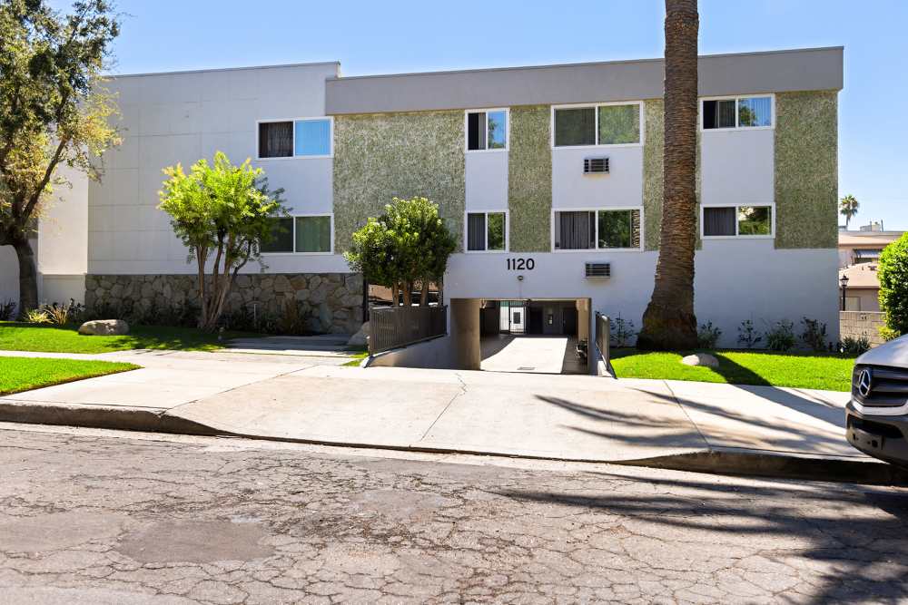 Exterior view of the building showcasing the driveway and the entry at The Indie Glendale Collection in Glendale, California