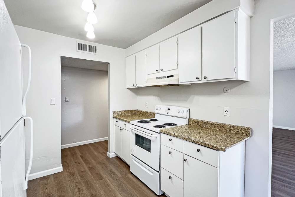 Kitchen with wooden cabinets at Village of the Pines in Reno, Nevada