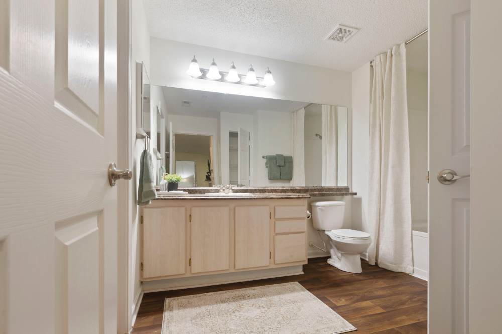 Bathroom1 with shower curtains at Hollis 7601 in Charlotte, North Carolina