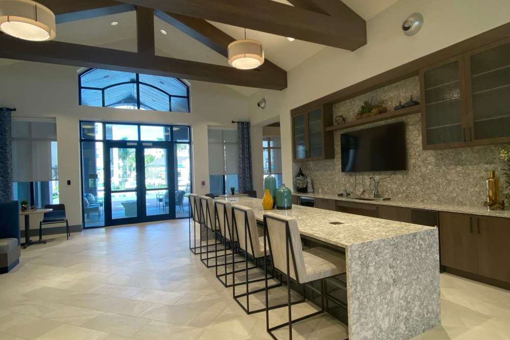 Clubhouse with built-in kitchen at Murano at Three Oaks in Fort Myers,Florida