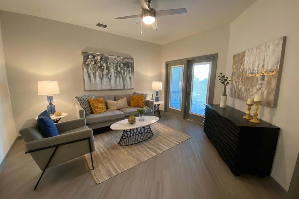 Living room with storage units at Murano at Three Oaks in Fort Myers,Florida