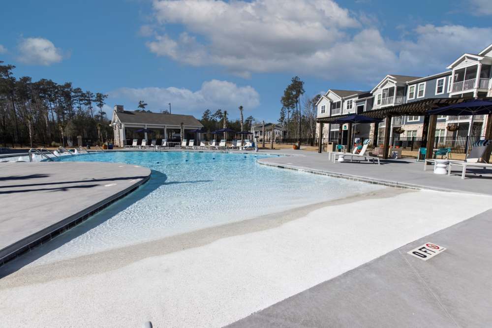 Swimming pool with cabana at South City Apartments in Summerville, South Carolina