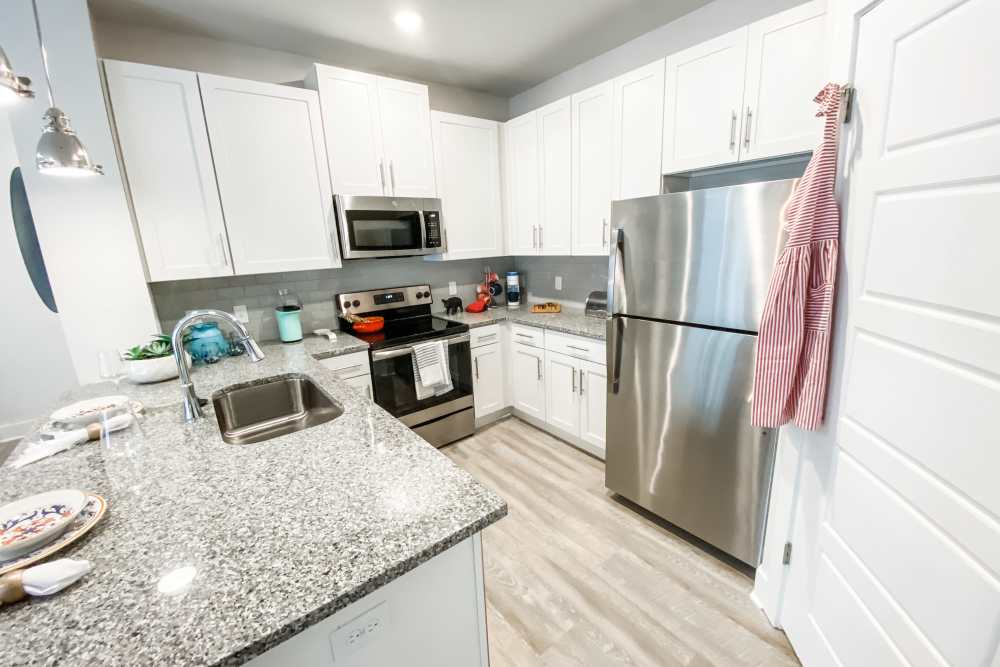 Kitchen with granite countertop at South City Apartments in Summerville, South Carolina