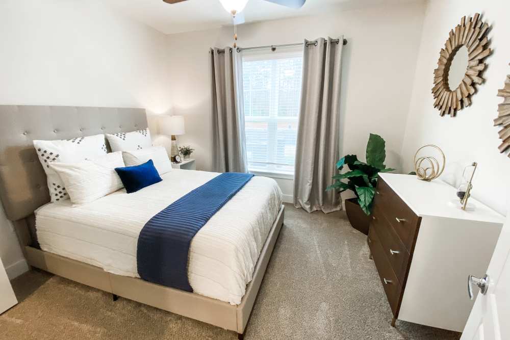 Bedroom with dresser at South City Apartments in Summerville, South Carolina