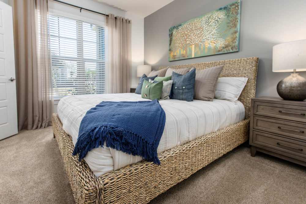 Bedroom with large window at South City Apartments in Summerville, South Carolina