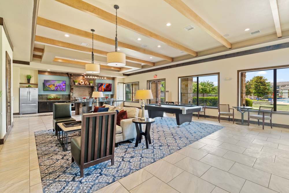 Clubhouse with lots of seating at The Abbey at Preserve Way in Tomball, Texas