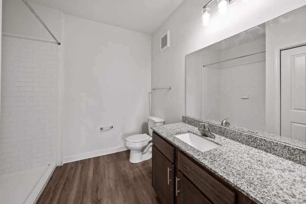 Bright bathroom with a large mirror at The Park at Massalina in Panama City,Florida