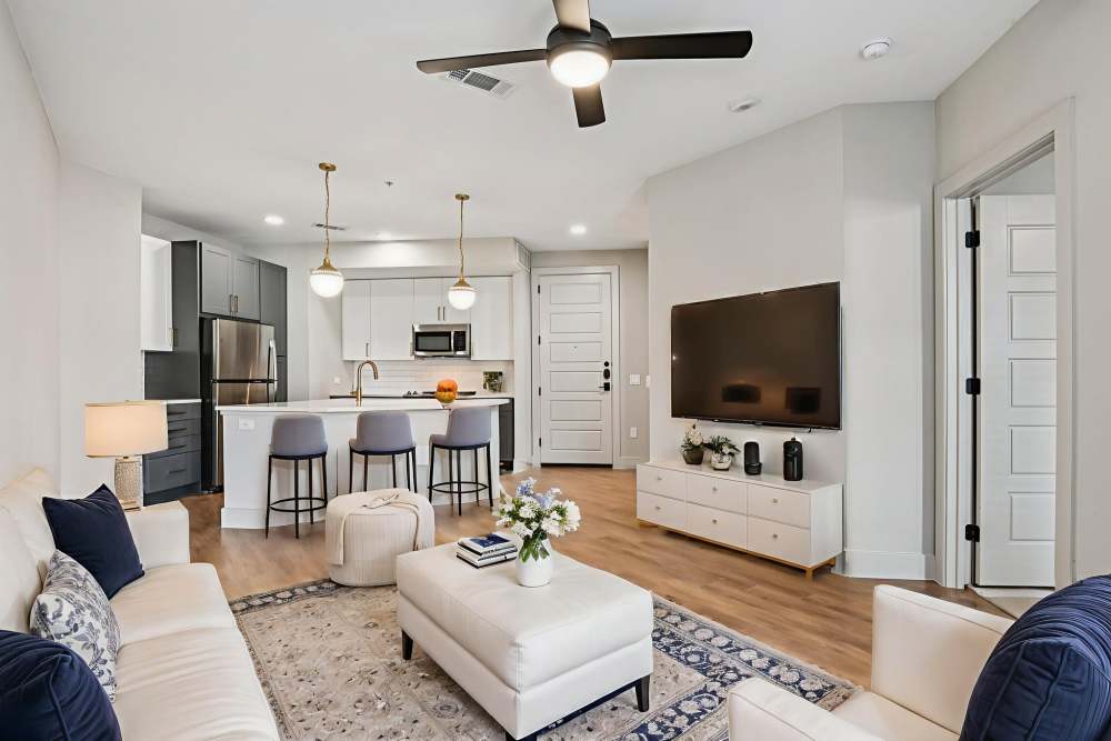 Living room with coffee table and couches at Vance at Bishop Union in Dallas, Texas