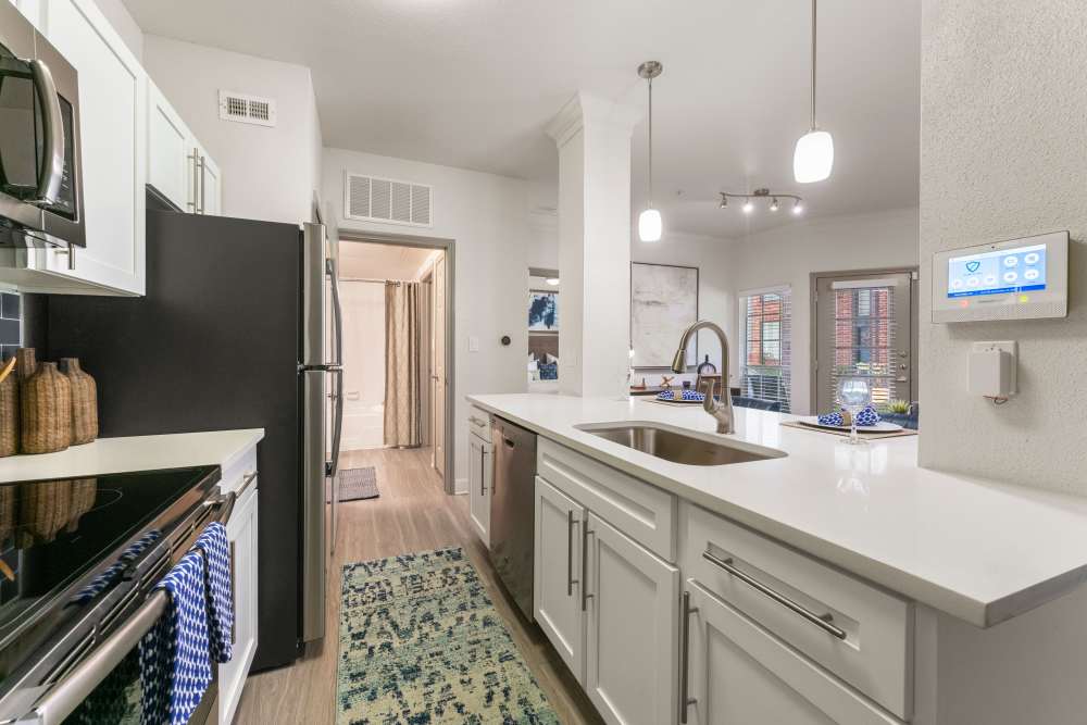 Spacious island kitchen with stainless steel appliances at Barnett in Houston, Texas