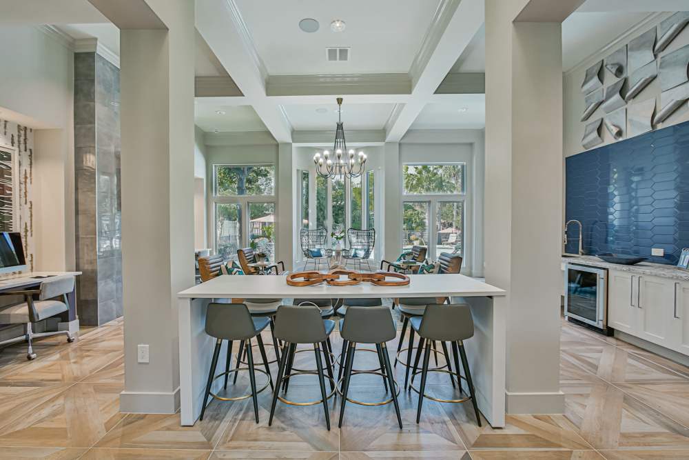 Clubhouse with bar seating and penant lights at Barnett in Houston, Texas