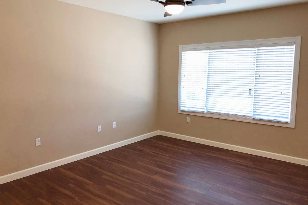 Bedroom with large windows at Grand Palms in Bradenton, Florida