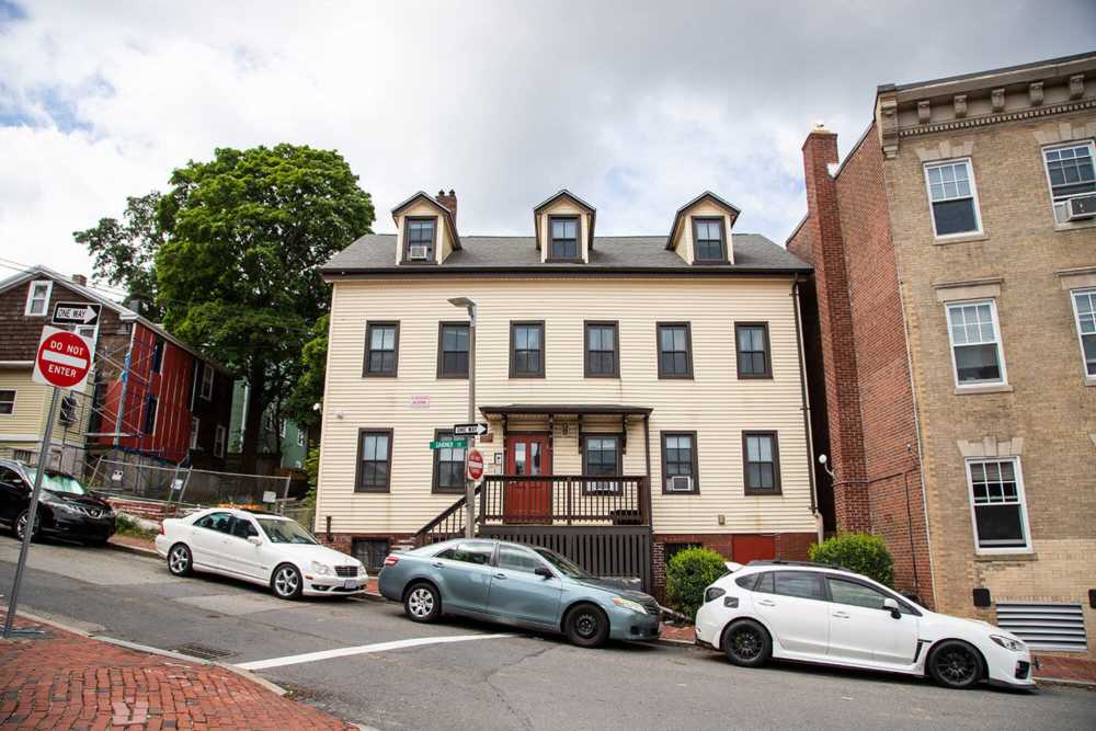 Front view of building with car parking facility at frontside at JPNDC Pitts Portfolio in Roxbury, Massachusetts