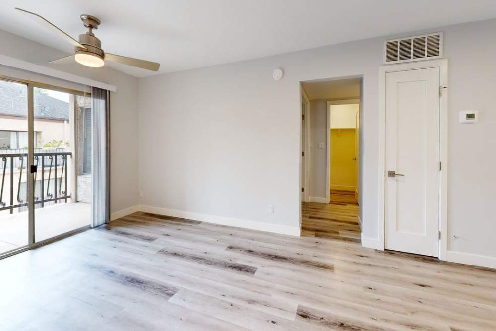 Spacious living room with sliding glass doors for patio access at The Indie Glendale Collection in Glendale, California