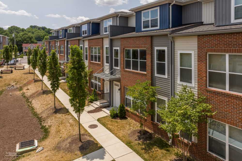 Community exterior with side walk at RiverWatch Apartments in Elkridge, Maryland