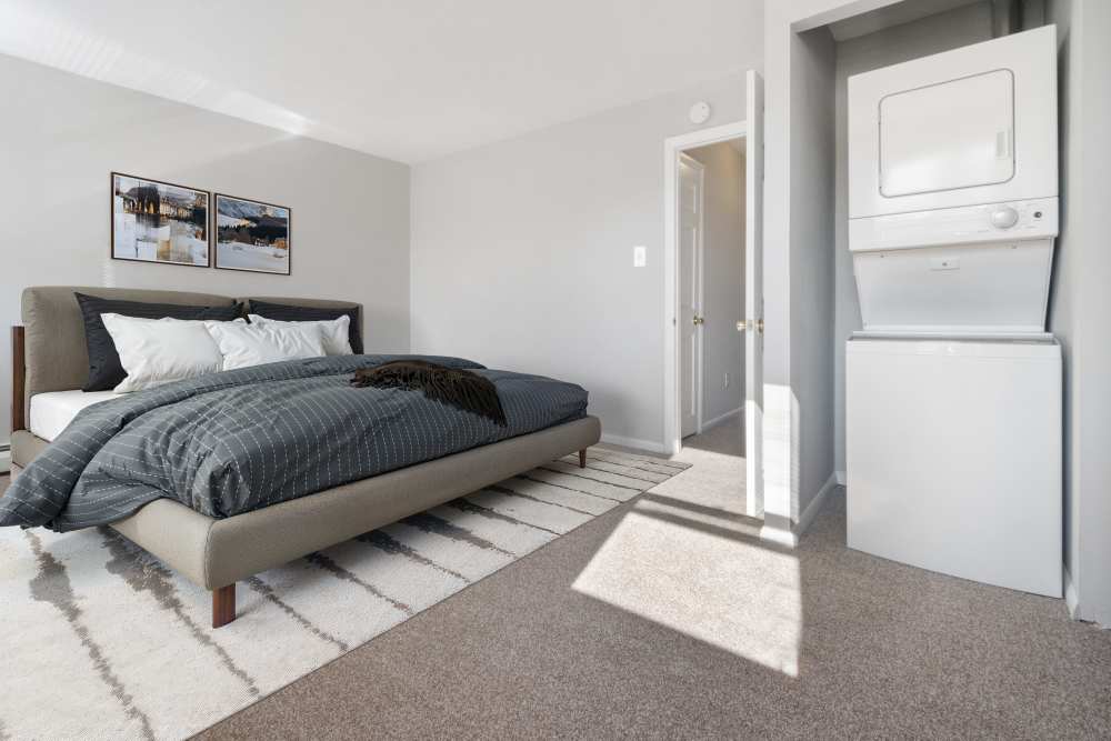 bedroom with laundry at Aston Pointe Apartments in Aston, Pennsylvania