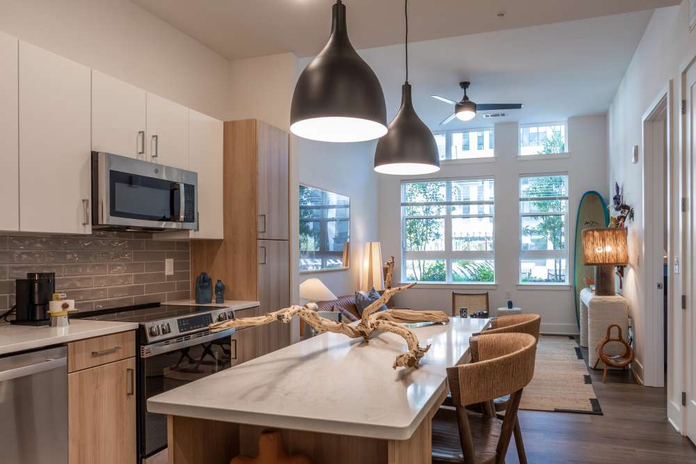 Open kitchen with dining area at St. Albans Lofts in Raleigh, North Carolina