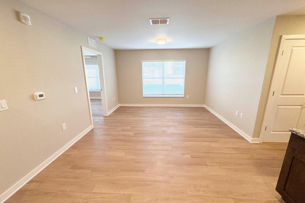 Unfurnished living room with wood-style flooring at Addison Grove in Avon Park,Florida