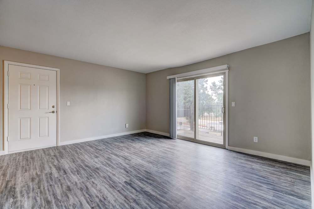 Unfurnished living room with wooden flooring  at Council Crossing in Bethany, Oklahoma