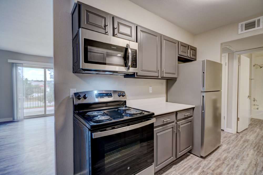 Kitchen with stainless steel appliance at Council Crossing in Bethany, Oklahoma