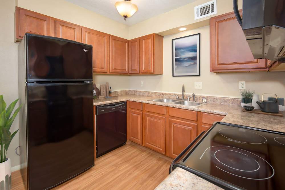 Kitchen with black color appliance at Council Crossing in Bethany, Oklahoma