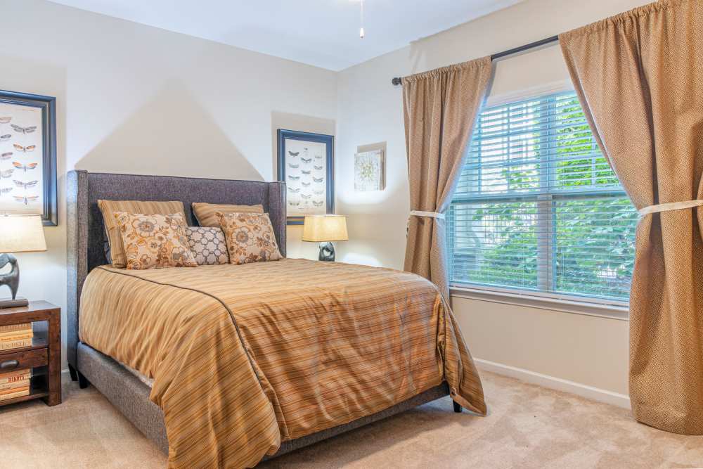 Bedroom with big window at Oasis at Montclair Apartments in Dumfries, Virginia