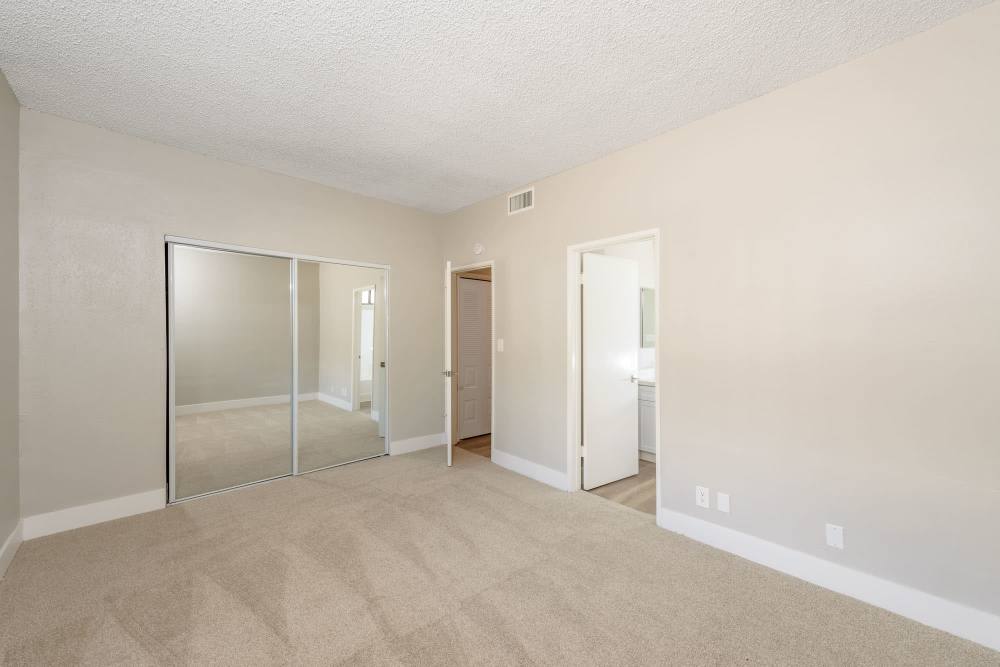 Empty room with carpet flooring and a walkin closet at The Indie Glendale Collection in Glendale, California