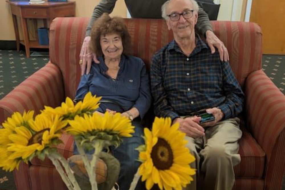 Residents with sunflower at Cardinal Village in Sewell, New Jersey