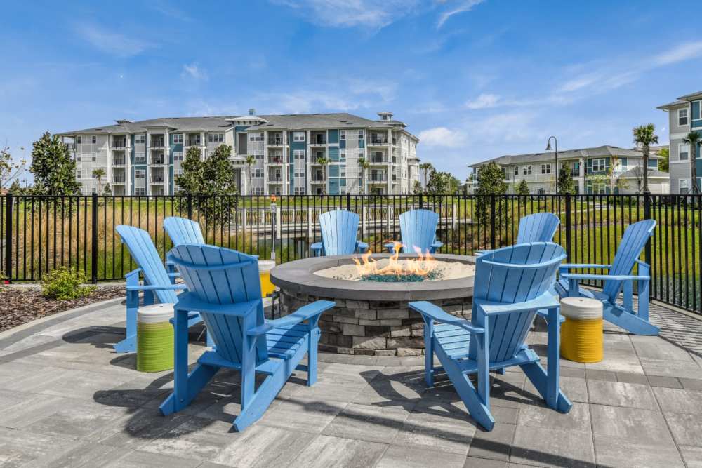 Outdoor firepit at Champions Vue Apartments in Davenport, Florida