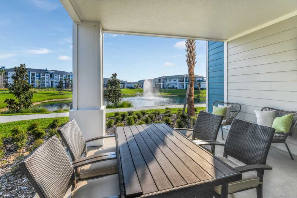 Outdoor seating space at Champions Vue Apartments in Davenport, Florida