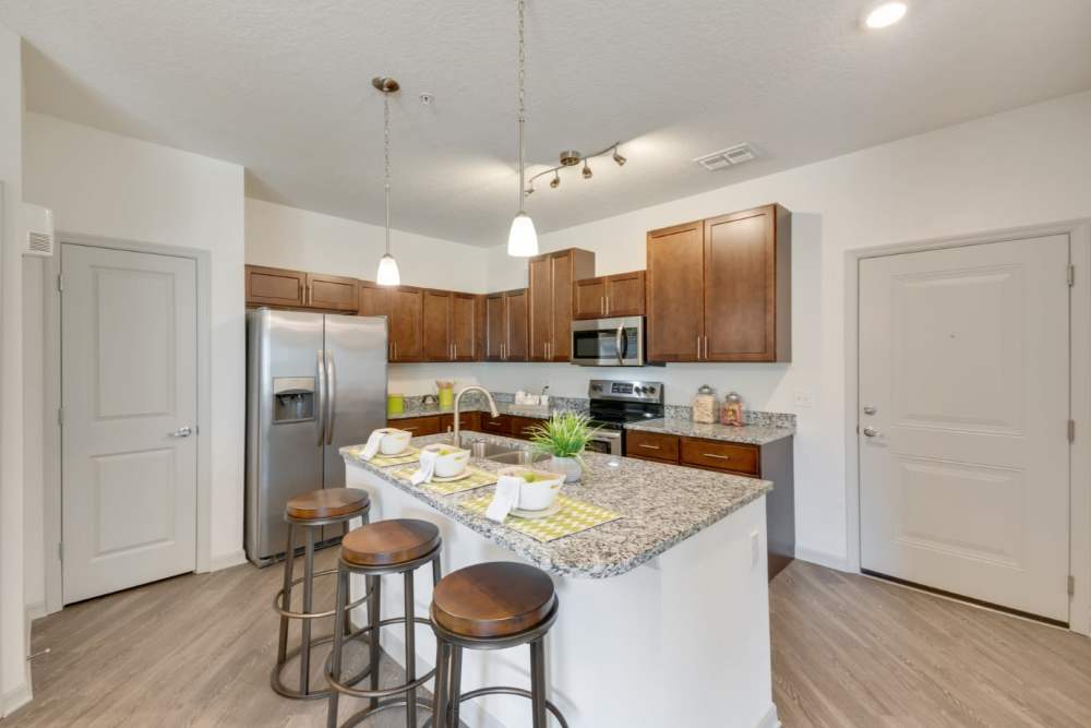 Fully equipped kitchen at Champions Vue Apartments in Davenport, Florida