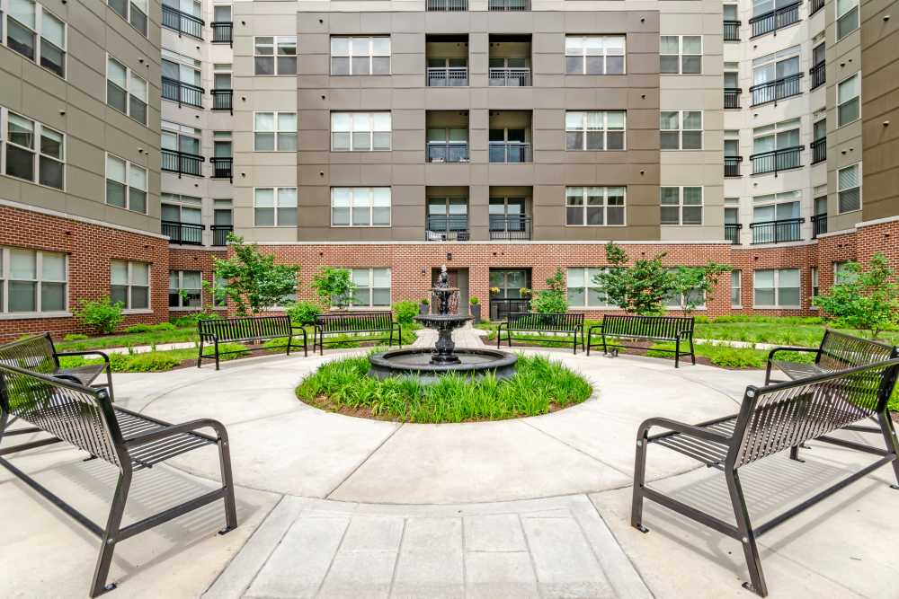 Building with outdoor seating at The Residences at Annapolis Junction in Annapolis Junction, Maryland