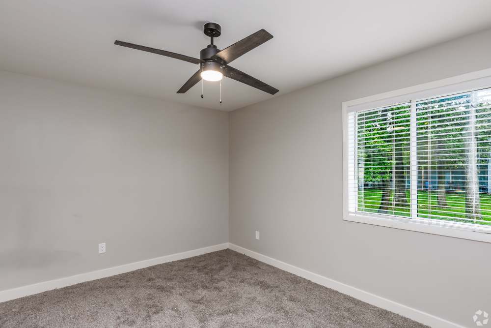 Bedroom with carpet and ceiling fan at Harborstone in Newport News, Virginia
