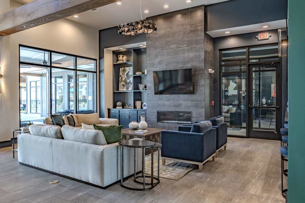 Resident woman cooking food in a modern kitchen at The Waters at Promenade in Marrero, Louisiana