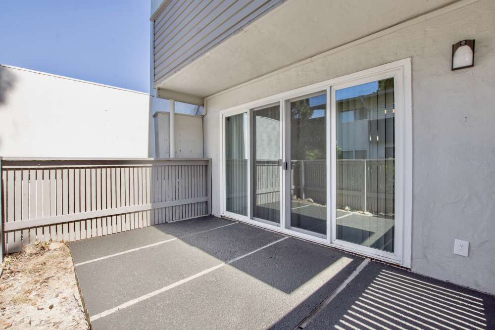 Private outdoor patio with sliding doors at The Eleven Hundred in Sacramento, California