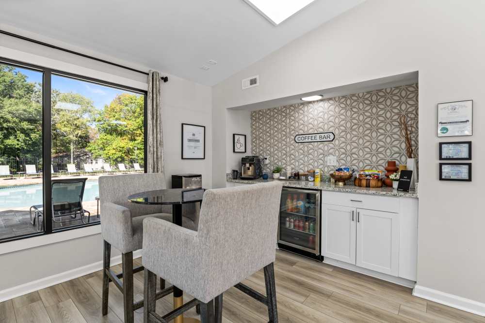 Community refreshment station with seating at Ascent Apartment Homes in Asheville, North Carolina