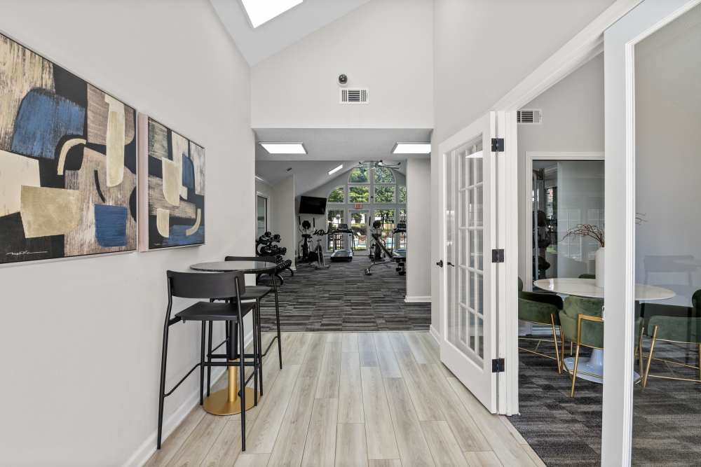 Hallway leading to fitness center at Ascent Apartment Homes in Asheville, North Carolina