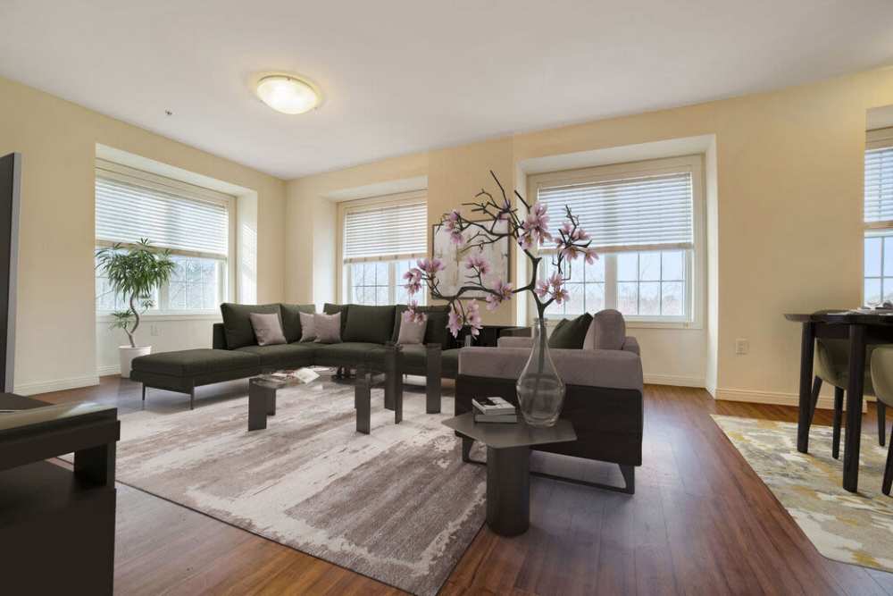 Living area with soft couches at The Residences at Lincoln Park in Dartmouth, Massachusetts
