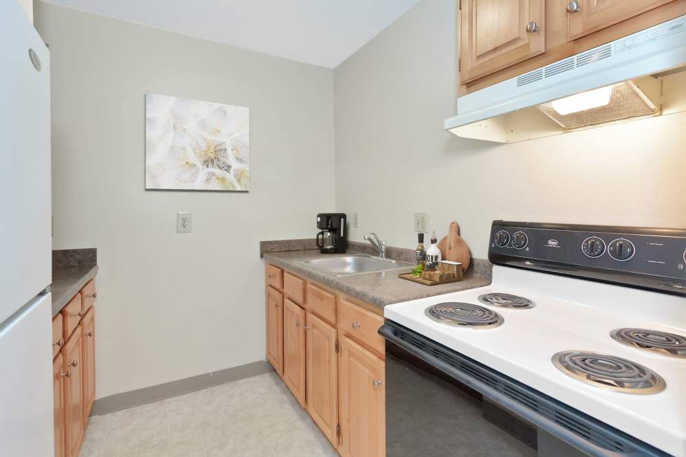 Kitchen with stove at Market Mill Apartments in Lowell, Massachusetts