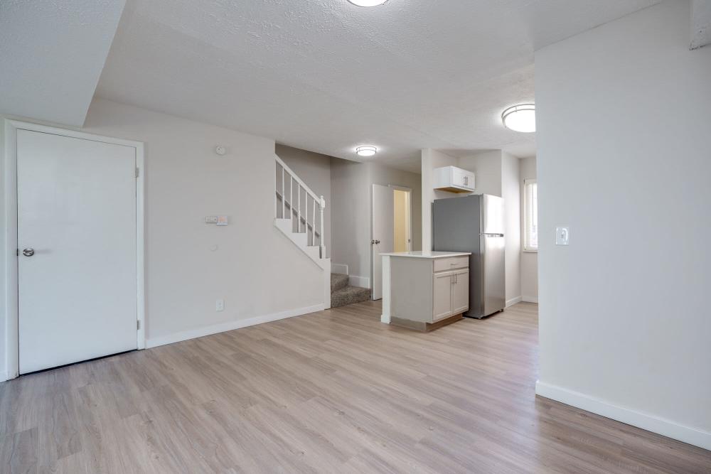 Living room with connecting kitchen space at Maple Oaks in Middletown, Ohio