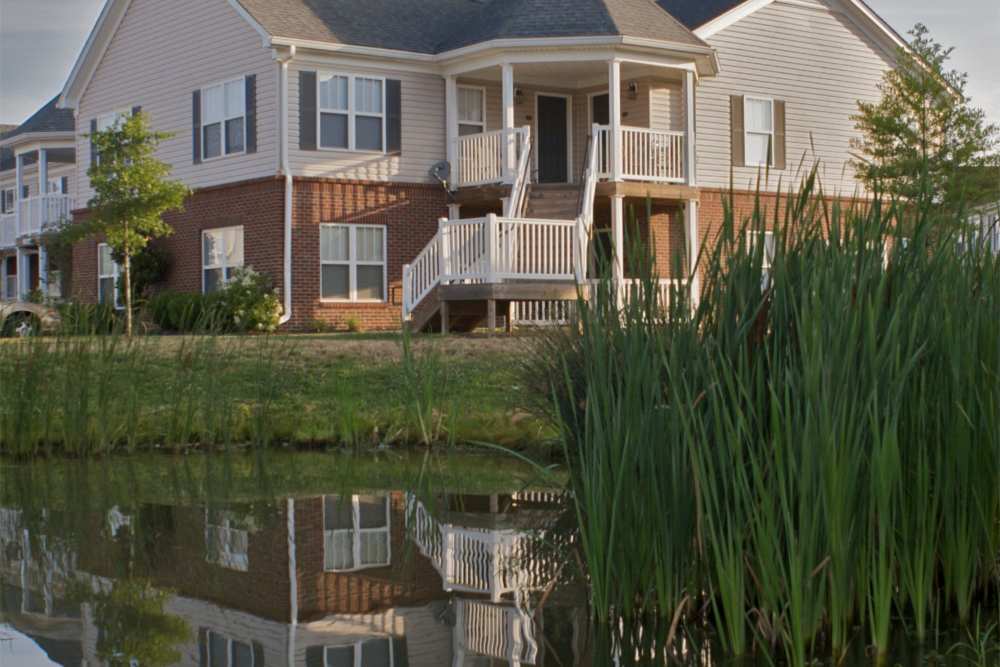 Property exterior with a lake outside at Falcon Crest Apartments in Louisville,Kentucky