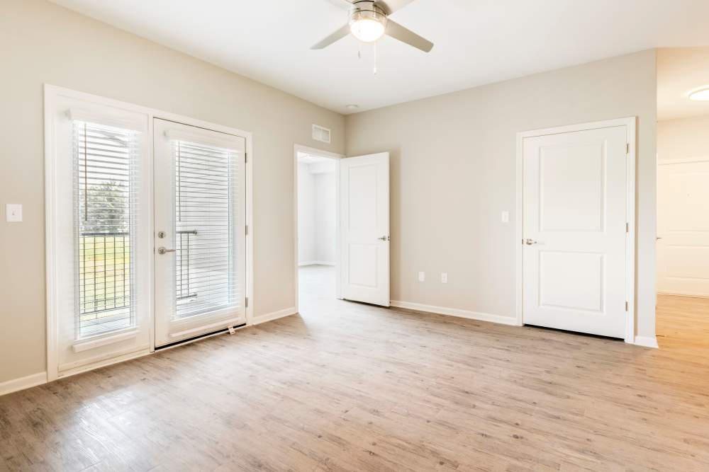 Unfurnished living room with ceiling fan at Jefferson Green in Louisville, Kentucky